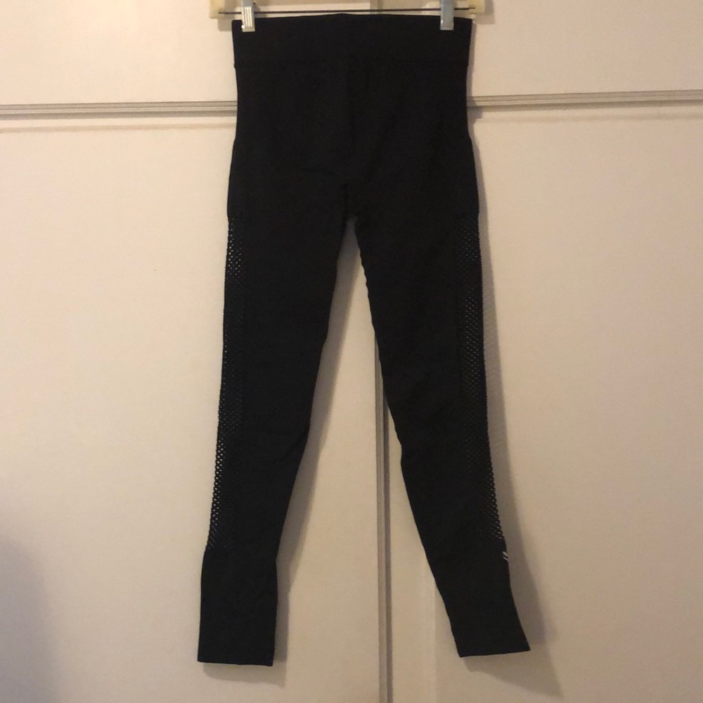 Stretchy black leggings with fish net sides